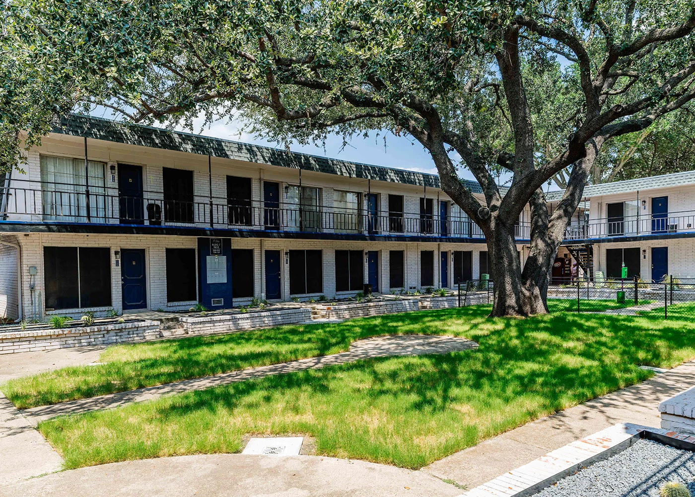 Renovated buildings and landscaped common areas at The Ashley